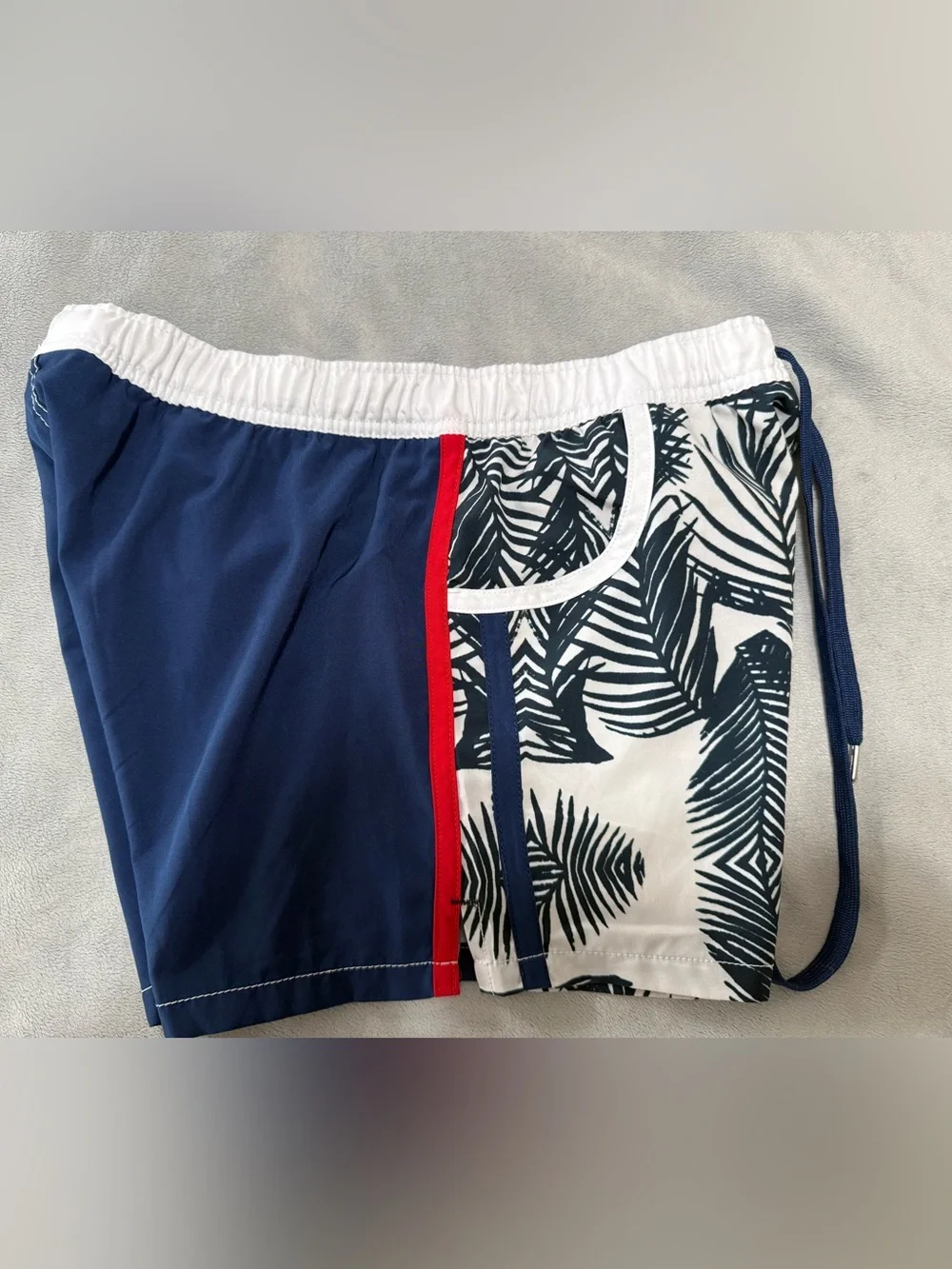 Andrew Christian lined swim trunks. They are a men’s large.